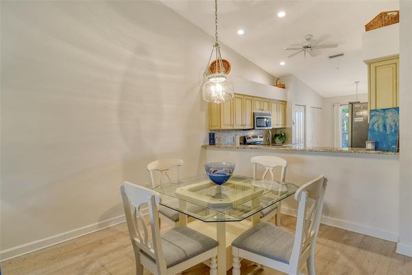 Dining room, Interior, Kitchen, Pendant Lights, Recessed Lighting, Stainless Steel Appliances, Wood Texture Flooring