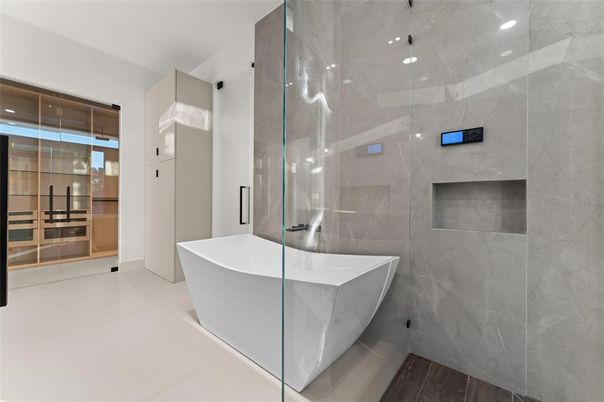 Bathroom, Free Standing Baths, Glass Shower, Interior, Marble Walls, Recessed Lighting