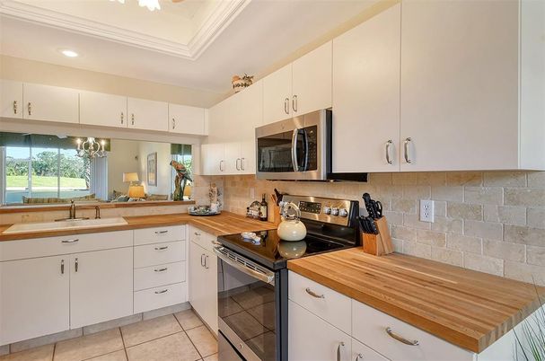 Interior, Kitchen, Recessed Lighting, Stainless Steel Appliances, Stone Walls