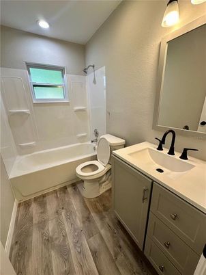 Bathroom, Dual Sink Vanities, Interior, Recessed Lighting, Wood Texture Flooring