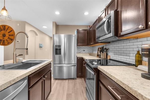 Interior, Kitchen, Pendant Lights, Recessed Lighting, Stainless Steel Appliances, Wood Texture Flooring