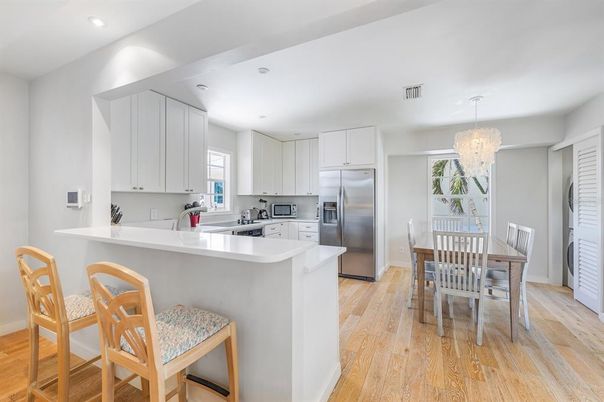 Chandelier, Dining room, Interior, Kitchen, Recessed Lighting, Stainless Steel Appliances, Wood Texture Flooring