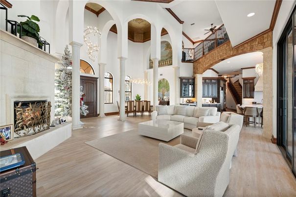 Chandelier, Dining room, Fireplace, Interior, Living room, Pendant Lights, Recessed Lighting, Wood Texture Flooring