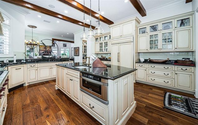 Chandelier, Interior, Kitchen, Pendant Lights, Recessed Lighting, Stainless Steel Appliances, Wooden Beams, Wood Texture Flooring