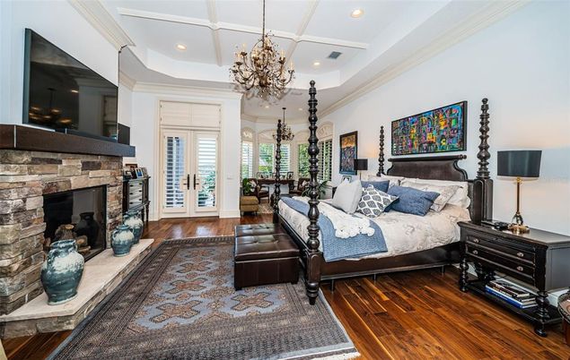 Bedroom, Chandelier, Fireplace, Interior, Recessed Lighting, Wood Texture Flooring