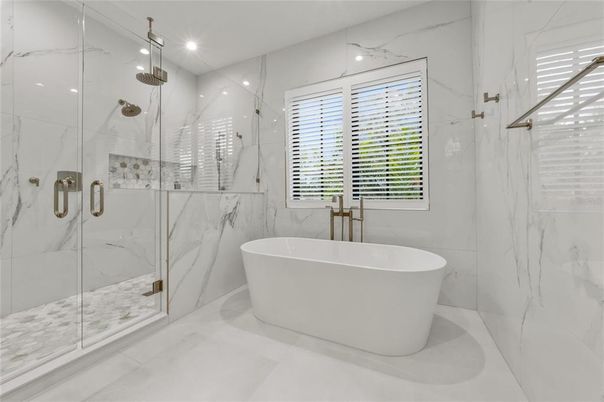 Bathroom, Free Standing Baths, Glass Shower, Interior, Marble, Marble Walls, Recessed Lighting