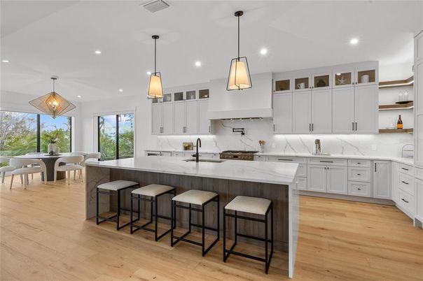 Dining room, Interior, Kitchen, Marble Walls, Pendant Lights, Recessed Lighting, Stainless Steel Appliances, Wood Texture Flooring