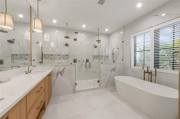 Bathroom, Dual Sink Vanities, Free Standing Baths, Glass Shower, Interior, Marble Walls, Pendant Lights, Recessed Lighting