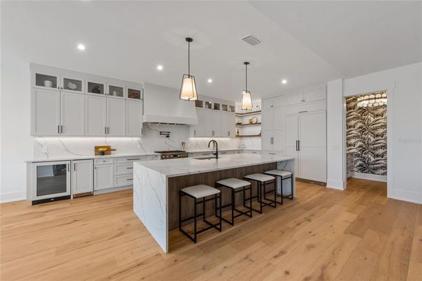Interior, Kitchen, Marble Walls, Pendant Lights, Recessed Lighting, Stainless Steel Appliances, Wood Texture Flooring