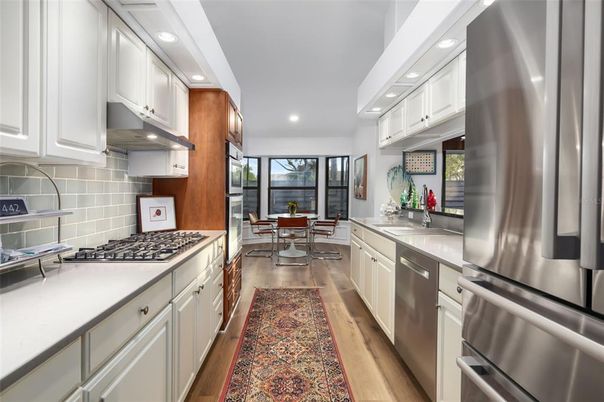 Dining room, Interior, Kitchen, Recessed Lighting, Stainless Steel Appliances, Wood Texture Flooring