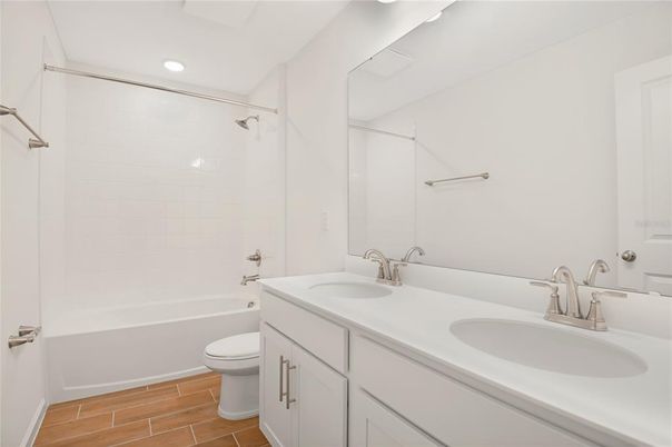 Bathroom, Dual Sink Vanities, Interior, Recessed Lighting, Wood Texture Flooring
