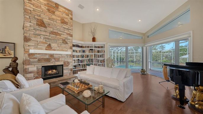 Fireplace, Interior, Living room, Piano, Recessed Lighting, Stone Walls, Wood Texture Flooring