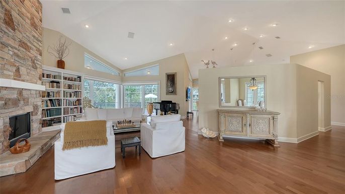 Fireplace, Interior, Living room, Piano, Recessed Lighting, Stone Walls, Wood Texture Flooring