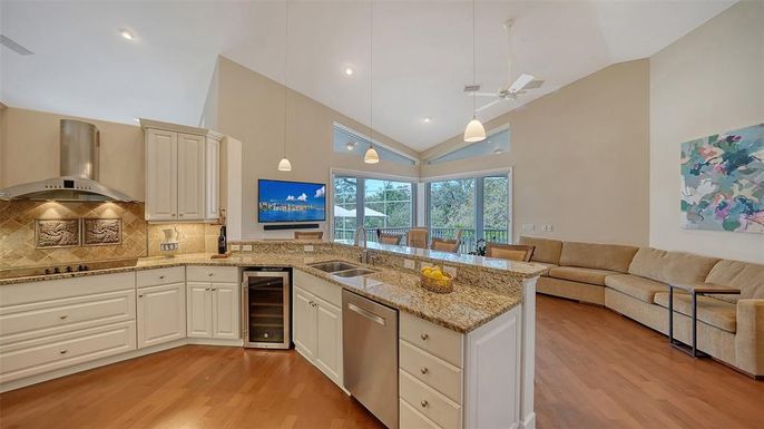 Dining room, Interior, Kitchen, Living room, Pendant Lights, Recessed Lighting, Stainless Steel Appliances, Wood Texture Flooring