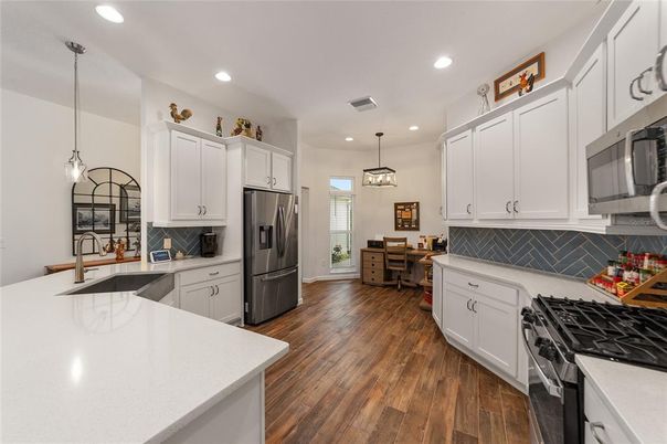 Dining room, Interior, Kitchen, Pendant Lights, Recessed Lighting, Stainless Steel Appliances, Wood Texture Flooring