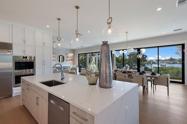 Dining room, Interior, Kitchen, Pendant Lights, Recessed Lighting, Stainless Steel Appliances, Wood Texture Flooring