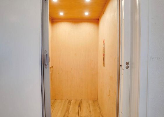 Elevator, Interior, Recessed Lighting, Wooden Ceilings, Wood Texture Flooring, Wooden Walls