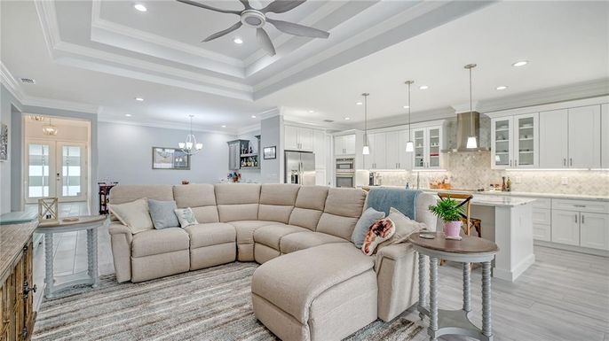 Chandelier, Interior, Kitchen, Living room, Pendant Lights, Recessed Lighting, Stainless Steel Appliances, Wood Texture Flooring