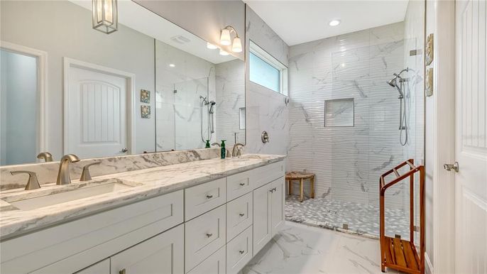 Bathroom, Dual Sink Vanities, Glass Shower, Interior, Marble, Marble Walls, Recessed Lighting