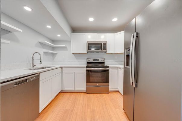Interior, Kitchen, Recessed Lighting, Stainless Steel Appliances, Wood Texture Flooring