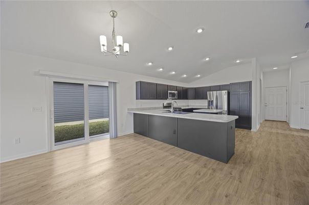 Chandelier, Interior, Kitchen, Recessed Lighting, Stainless Steel Appliances, Wood Texture Flooring