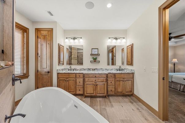 Bathroom, Dual Sink Vanities, Free Standing Baths, Interior, Recessed Lighting, Wood Texture Flooring