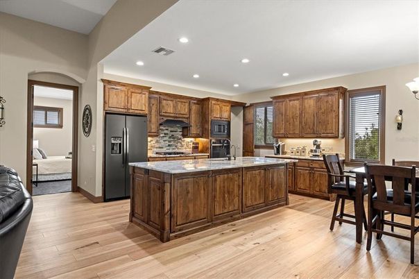 Dining room, Interior, Kitchen, Recessed Lighting, Stainless Steel Appliances, Wood Texture Flooring