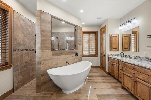 Bathroom, Dual Sink Vanities, Free Standing Baths, Glass Shower, Interior, Recessed Lighting, Wood Texture Flooring