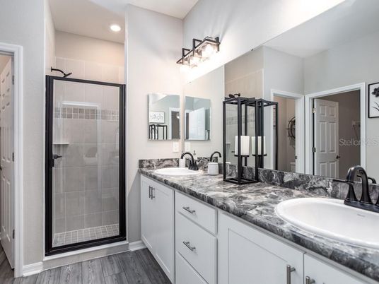Bathroom, Dual Sink Vanities, Glass Shower, Interior, Recessed Lighting, Wood Texture Flooring