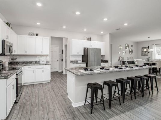 Chandelier, Dining room, Interior, Kitchen, Pendant Lights, Recessed Lighting, Stainless Steel Appliances, Wood Texture Flooring