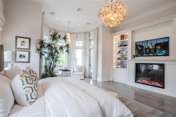 Bedroom, Chandelier, Fireplace, Interior, Pendant Lights, Recessed Lighting, Wood Texture Flooring