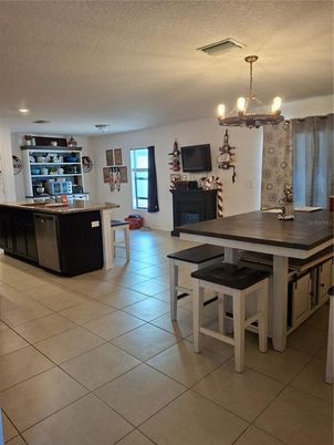 Chandelier, Dining room, Fireplace, Interior, Kitchen