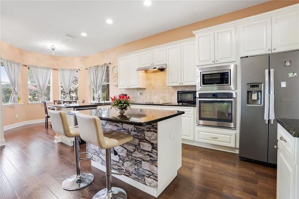 Dining room, Interior, Kitchen, Recessed Lighting, Stainless Steel Appliances, Wood Texture Flooring