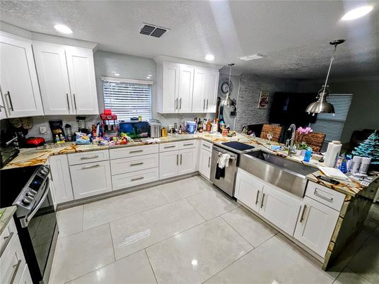 Interior, Kitchen, Pendant Lights, Recessed Lighting, Stainless Steel Appliances, Stone Walls