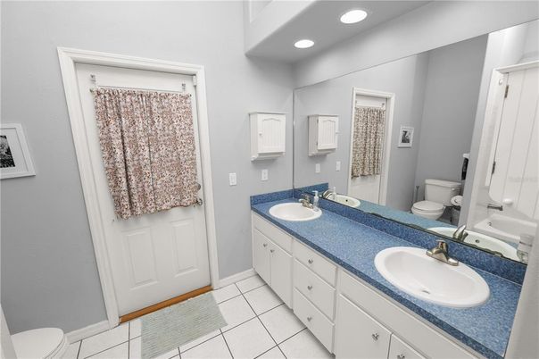 Bathroom, Dual Sink Vanities, Interior, Recessed Lighting, Tile Countertops