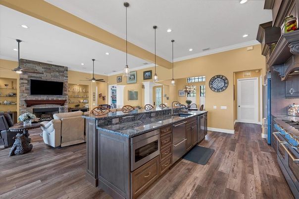Fireplace, Interior, Kitchen, Living room, Pendant Lights, Recessed Lighting, Stone Walls, Wood Texture Flooring