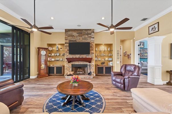 Fireplace, Interior, Living room, Recessed Lighting, Stone Walls, Wood Texture Flooring