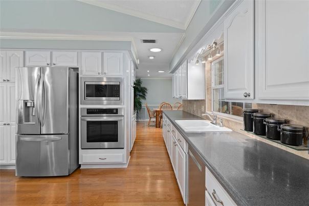 Dining room, Interior, Kitchen, Recessed Lighting, Stainless Steel Appliances, Wood Texture Flooring