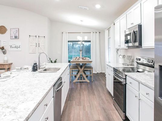 Dining room, Interior, Kitchen, Pendant Lights, Recessed Lighting, Stainless Steel Appliances, Wood Texture Flooring