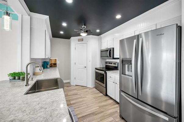 Interior, Kitchen, Recessed Lighting, Stainless Steel Appliances, Wood Texture Flooring