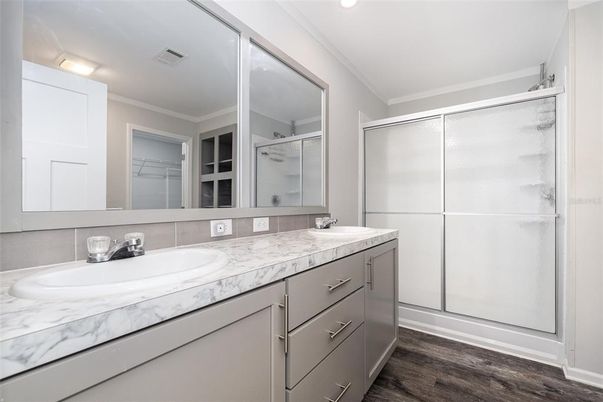 Bathroom, Dual Sink Vanities, Glass Shower, Interior, Recessed Lighting, Wood Texture Flooring