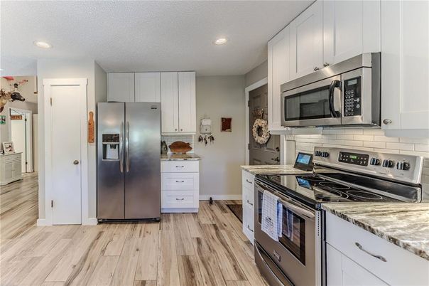 Interior, Kitchen, Recessed Lighting, Stainless Steel Appliances, Wood Texture Flooring