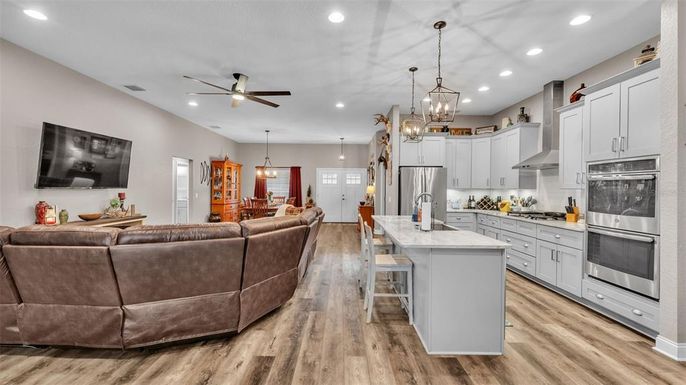 Dining room, Interior, Kitchen, Living room, Pendant Lights, Recessed Lighting, Stainless Steel Appliances, Wood Texture Flooring