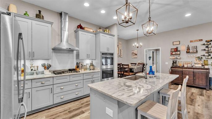 Chandelier, Interior, Kitchen, Pendant Lights, Recessed Lighting, Stainless Steel Appliances, Wood Texture Flooring