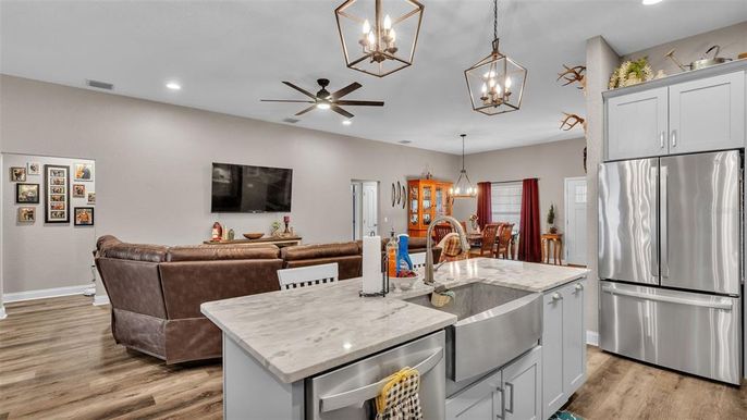 Dining room, Interior, Kitchen, Living room, Pendant Lights, Recessed Lighting, Stainless Steel Appliances, Wood Texture Flooring