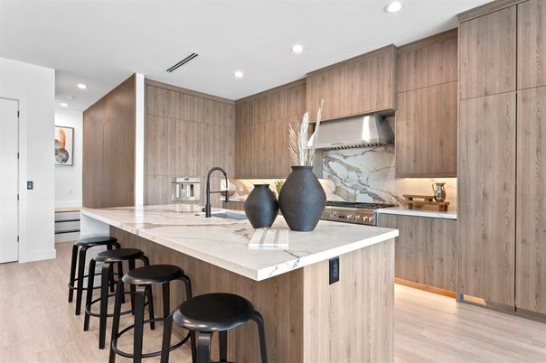Interior, Kitchen, Marble Walls, Recessed Lighting, Stainless Steel Appliances, Wood Texture Flooring