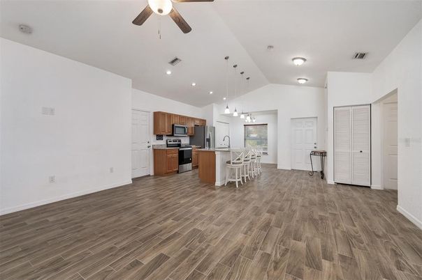 Chandelier, Dining room, Interior, Kitchen, Pendant Lights, Recessed Lighting, Stainless Steel Appliances, Wood Texture Flooring
