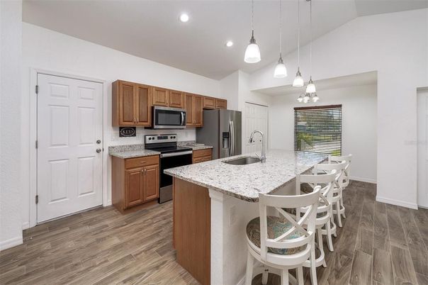 Interior, Kitchen, Pendant Lights, Recessed Lighting, Stainless Steel Appliances, Wood Texture Flooring