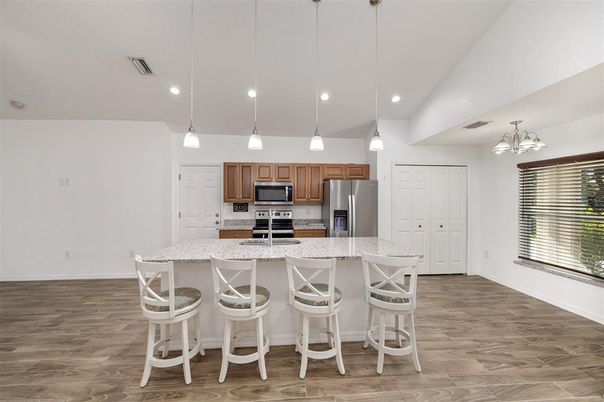 Interior, Kitchen, Pendant Lights, Recessed Lighting, Stainless Steel Appliances, Wood Texture Flooring