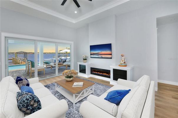 Fireplace, Interior, Living room, Recessed Lighting, Water, Wood Texture Flooring